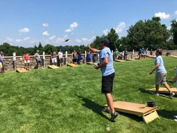 Throwing a flat bag in cornhole