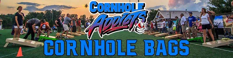 a group of people on a field playing corn hole with dual sided cornhole bags
